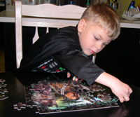 Tommy does the whole 100-piece Chewbacca puzzle... again!