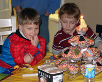 Tommy and Aiden think about something delicious.
