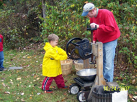 Tommy's making apple cider.