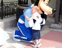 Nicholas hugs Goofy.