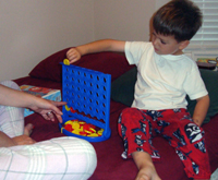 Playing Connect 4 before bed.